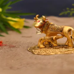 CraftVatika Gold Toned Kamdhenu Cow With Calf 
